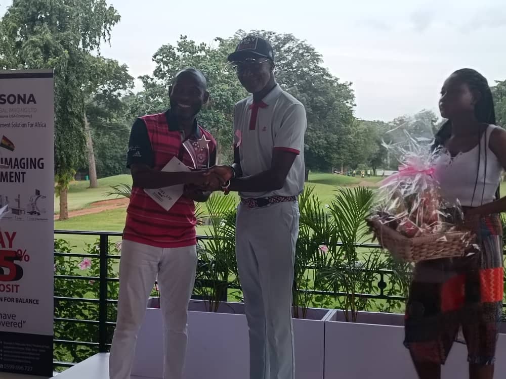 Men Group B winner Phillip Ayesu (left) receiving his prize Men Group B winner Phillip Ayesu (left) receiving his prize
